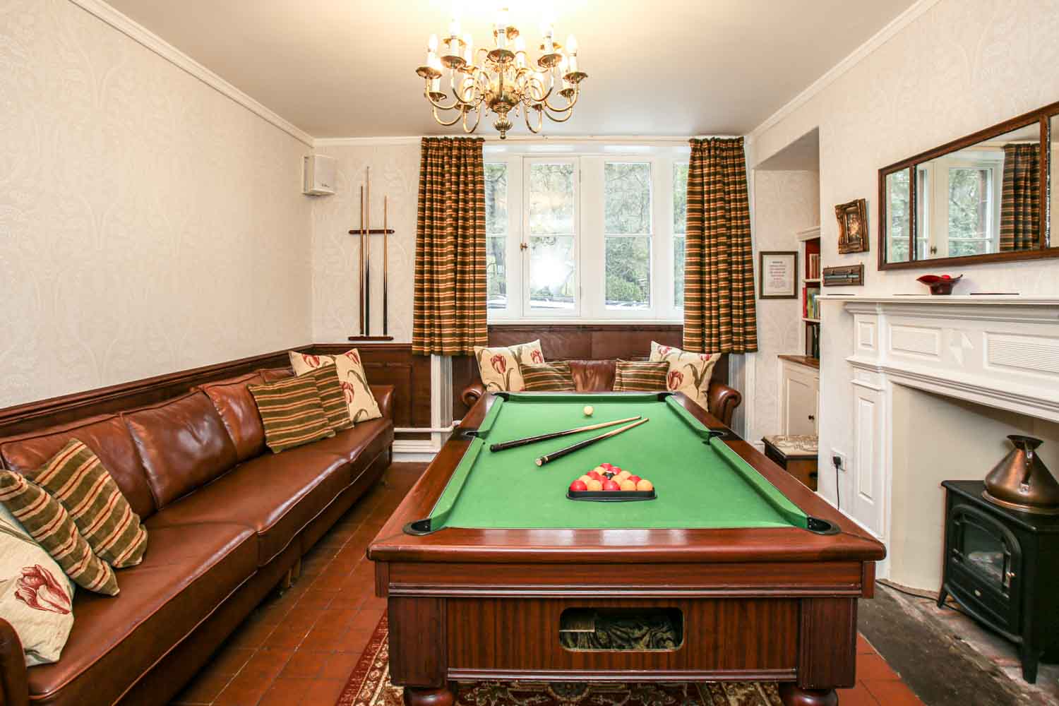 play pool at Roaches Hall, a Stag Party House in Derbyshire for 30 guests